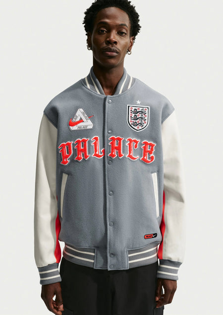 Nike x Palace Eng Varsity Jacket - Pewter Grey — shown on model